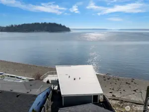 An aerial view of this cottage with 2-car garage and 1310 sq. ft. of living space.