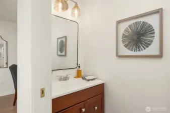 Convenient guest bathroom tucked away on the main level