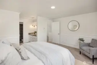 Primary bedroom features walk-in closet, dual vanity, shower, and soaking tub