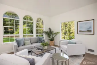 Two living spaces on the main floor, and another family room downstairs