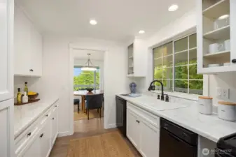 New counters and a new built-in microwave in the kitchen which overlooks the wrap-around deck and yard