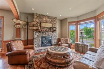 One of four stately fireplaces...enjoy this spacious front living room off the entrance - a perfect place to sit w/guests!
