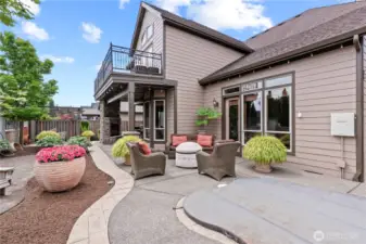 Simply stunning grounds! Aggregate concrete, stamped borders, beautifully landscaped and meticulously kept. Inground hot tub/spa (w/cover), outdoor space offers multiple spots to retreat and enjoy!