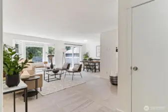 Bright and open living room with large windows for natural ight