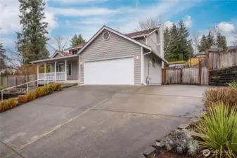 Extra parking space next to the garage, plus RV parking potential behind the gate!
