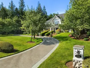 Paved circular driveway with side load 4 car garage