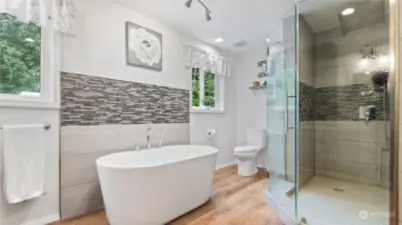 Luxurious Primary bath suite - separate shower and tub with double sinks and quartz counters