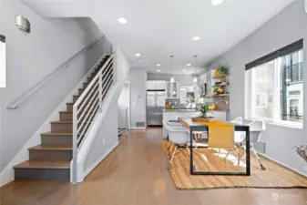 From the main living area, ascend the stairs to the top floor.