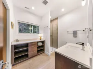 Large bathroom in the Casita with walk in shower, additional cabinets and countertop space and a large closet.