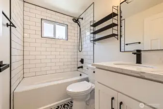 Primary bathroom with shower and tub.