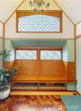 Light and bright entry with vaulted ceilings and inlayed floors