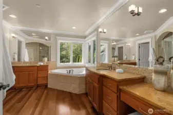 Large ensuite bath with dual vanities, soaking tub...