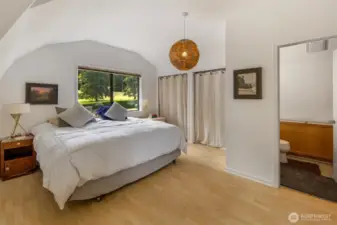The bedroom in the apartment above the shop. The door on the right leads to the bathroom.