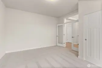 Off the front entry hall clear glass doors open into what could be a den/office space or a 3rd bedroom.