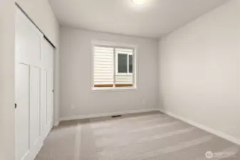 Adjacent to full bathroom is the second bedroom featuring a large reach-in closet.