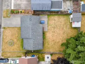 Fully fenced yard with large shed and covered lean too for more storage.