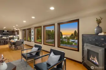Open floor plan with kitchen, dining room, living room with gas fireplace and those views!