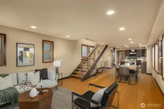 Nice to have it all - living room, dining room, kitchen and floating staircase!