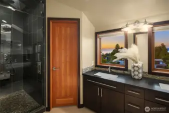 Double sinks and walk-in shower with 8 sprayer heads in primary bathroom + those views!