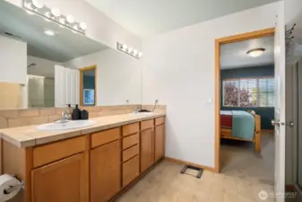 The primary bath has a dual sink vanity.