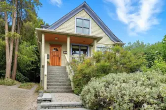 On a quiet, dead end street bordering sunny Judkins Park, find this proud 1904 Craftsman.