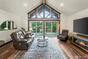 Vaulted ceilings create an open, inviting atmosphere drawing your eyes to the magificent views.  The windows and doors are trimmed in high end black walnut providing a warm and luxurious feel to the spaces.