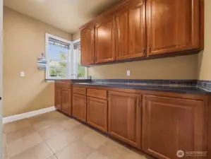 Look at all the cabinets in this laundry room
