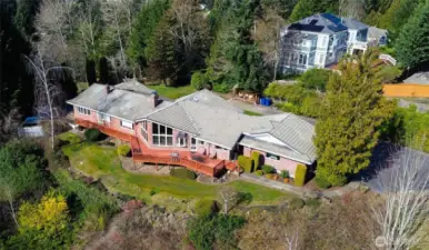 Perched above the landscape with sweeping views of Mount Rainier and the surrounding foothills, this architecturally designed Northwest retreat invites you to slow down, breathe deeply, and savor the beauty of the changing skies. From sunrise glow to dramatic weather rolling across the valley, every day brings a new natural masterpiece right outside your windows. Thoughtfully positioned for privacy and tranquility, the home feels worlds away—yet it’s conveniently close to town, offering the perfect balance of seclusion and accessibility. Expansive windows, warm natural materials, and a layout that embraces the outdoors create a sense of calm the moment you step inside this classic, one-level home.