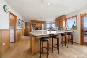 View of the large kitchen off to the left as you have entered the home. The kitchen is also accessed from the 3-car garage.