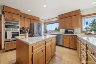 Another view of the large kitchen with updated countertops and newer appliances.