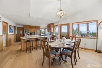 View of the dining room and kitchen, ample oak cabinets, large walk-in pantry and built-ins.