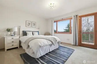 All of the bedrooms are generously-sized. This bedroom offers access to the deck and incredible views of Mt. Rainier.