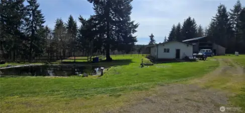View of the duck pond, shop & barn