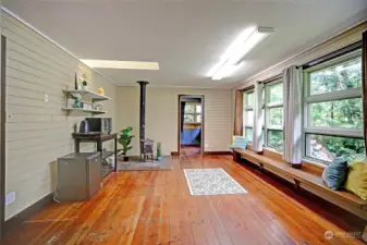 ADU Living room /kitchenette with wood stove for heat.