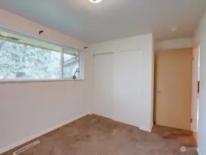 Upper level bedroom facing backyard.