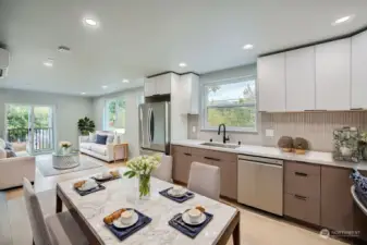 Open concept kitchen and living room with enough space for a dining table.