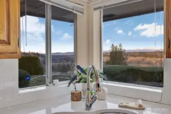 Mt. Baker and Mt Pilchuck views from your kitchen sink?! This corner will make clean up not a chore but a pleasure.