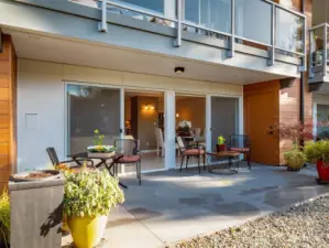 Spacious patios with sunny orientations are so delightful.  This one features room for planters & outdoor furniture.