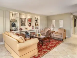 With muted wall colors, tile flooring and stunning built-ins, the Living Room is very inviting.