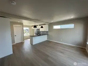 Great room with door to left leading to powder room