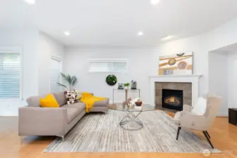 Generous family room features gas fireplace.
