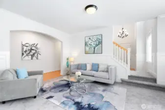 Elegant wainscoting flows from office to formal living. Gleaming maple hardwood floors extends from foyer to hallway, kitchen & family room.