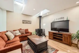 family room w/ wood stove and skylights