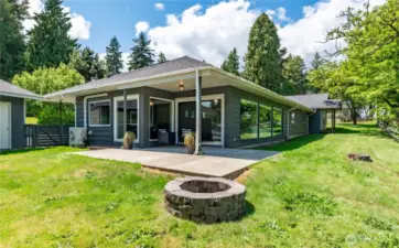 covered patio and firepit off dining room