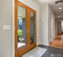 French door entry with ceramic tile floors