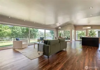 Greatroom with hardwood floors and expansive windows