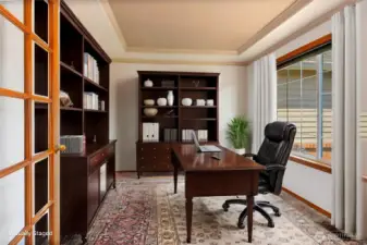 Office with French doors for privacy.