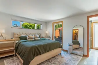 Primary bedroom with designated private access to back patio.
