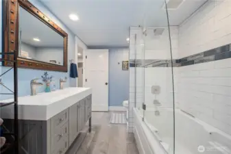 New soaker tub with custom glass enclosure.