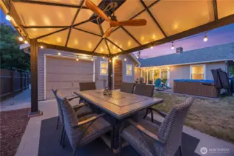 Gazebo seating with fan and fire table.